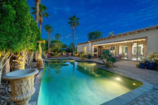 view of pool featuring a patio area