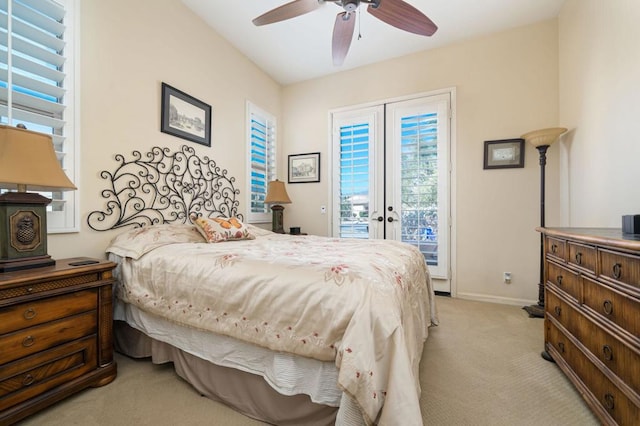 carpeted bedroom with french doors, access to outside, and ceiling fan