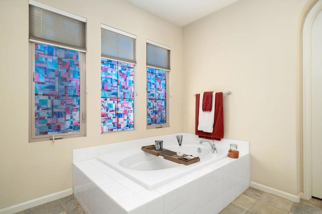 bathroom featuring tile patterned floors and tiled tub