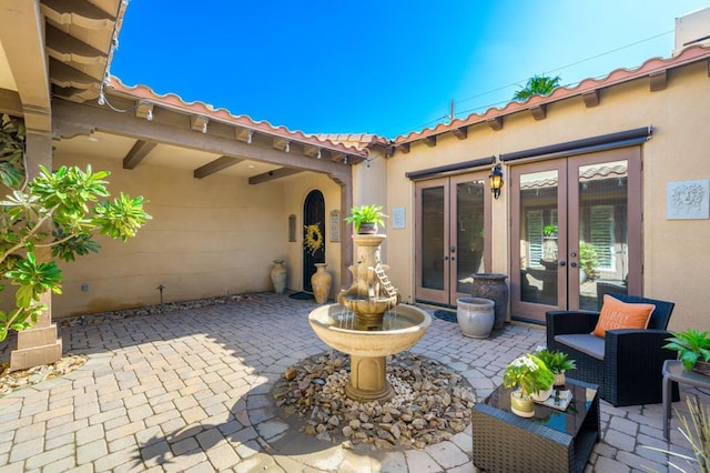 view of patio featuring french doors