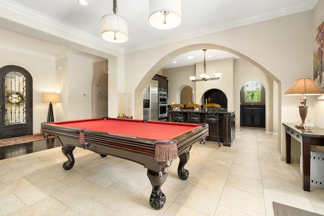 rec room with crown molding, light tile patterned floors, a chandelier, and pool table