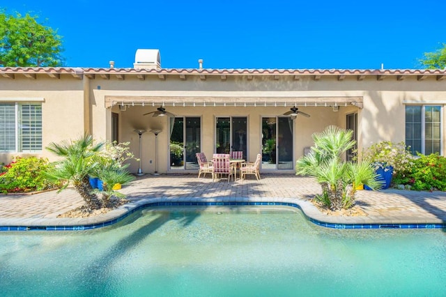 back of property featuring a patio and ceiling fan