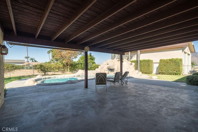 view of patio featuring a fenced in pool