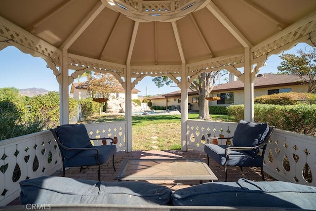 view of patio with a mountain view and a gazebo