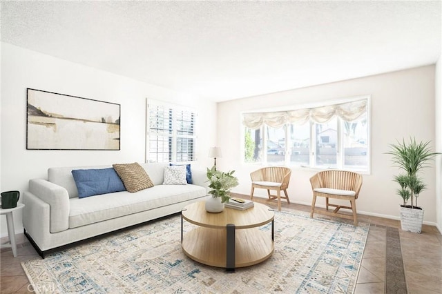 tiled living room featuring a textured ceiling