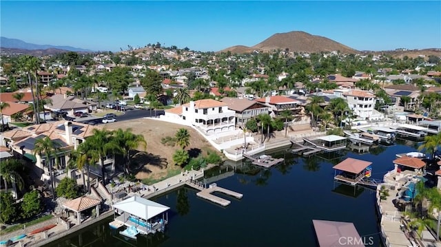 aerial view featuring a water and mountain view