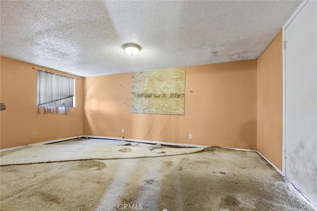 empty room with a textured ceiling