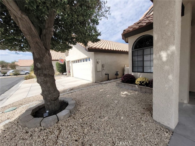 view of side of property featuring a garage