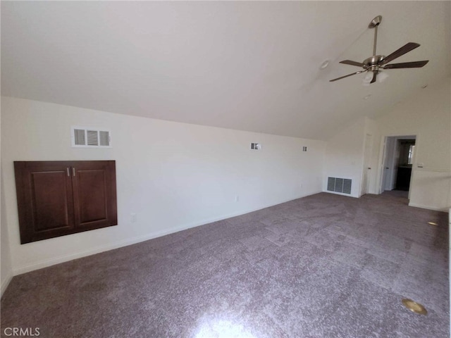 unfurnished living room featuring vaulted ceiling, carpet flooring, and ceiling fan