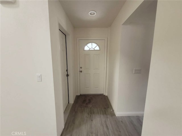 doorway with hardwood / wood-style floors