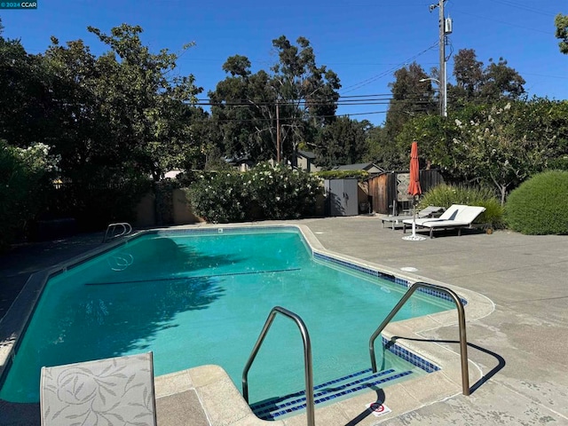 view of swimming pool featuring a patio area