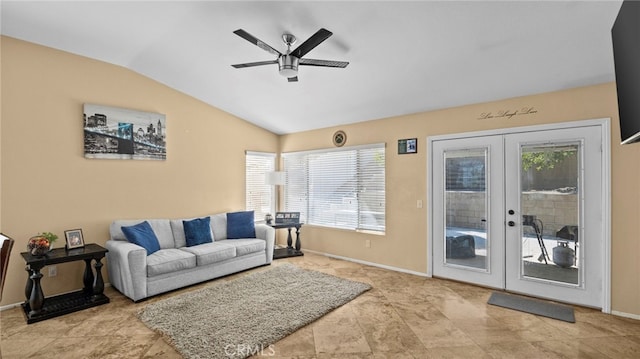 living room with ceiling fan, french doors, vaulted ceiling, and a wealth of natural light