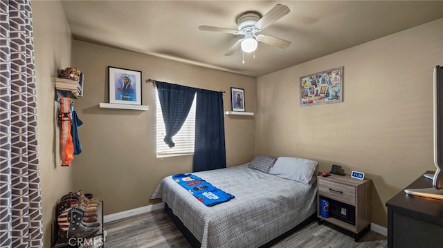 bedroom with ceiling fan and hardwood / wood-style flooring