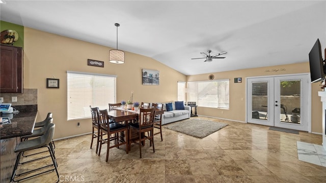 dining room featuring ceiling fan and vaulted ceiling