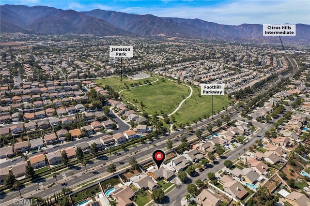 drone / aerial view featuring a mountain view