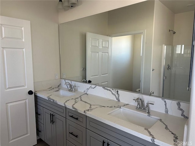 bathroom featuring vanity, an enclosed shower, and toilet