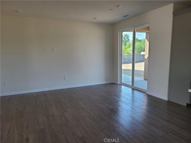 unfurnished room featuring dark hardwood / wood-style floors