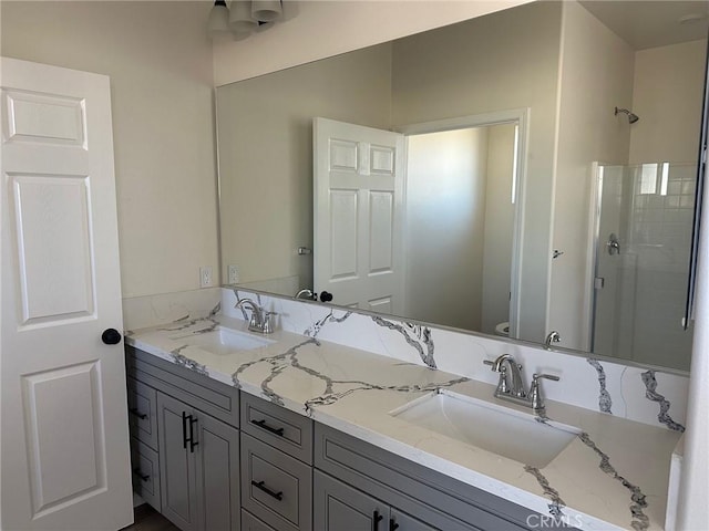 bathroom with vanity, toilet, and an enclosed shower