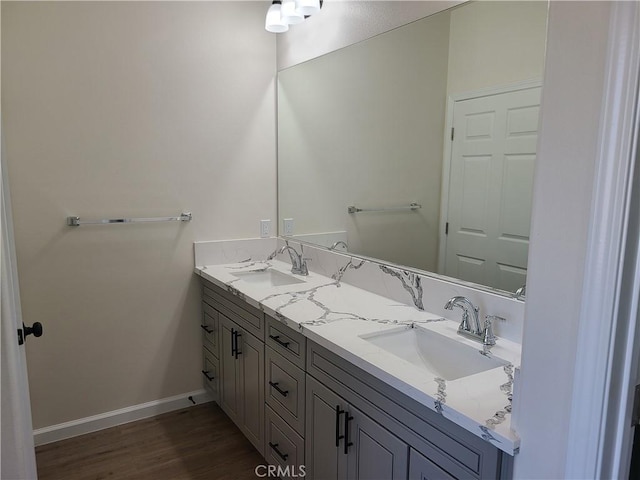 bathroom with hardwood / wood-style floors and vanity