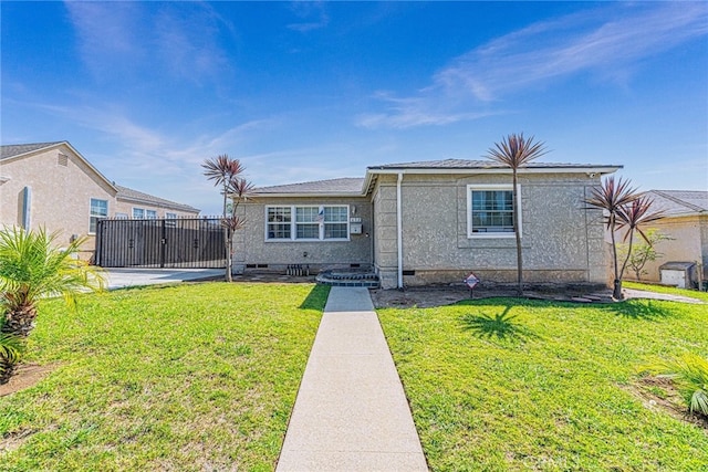 view of front of home with a front lawn and a patio