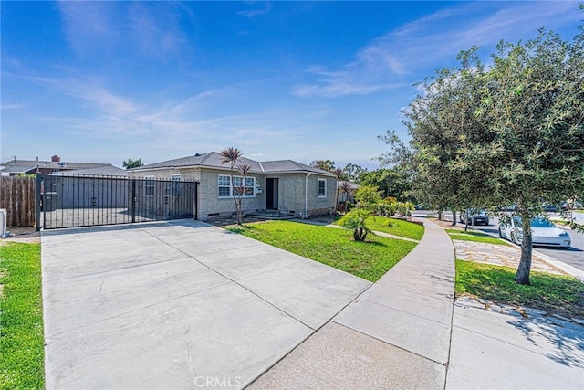 ranch-style home with a front lawn