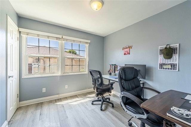 office space with light hardwood / wood-style flooring