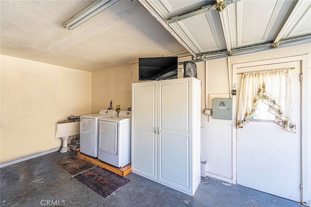 clothes washing area with washing machine and dryer