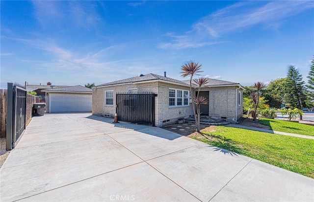 view of front of property with a front yard and a garage