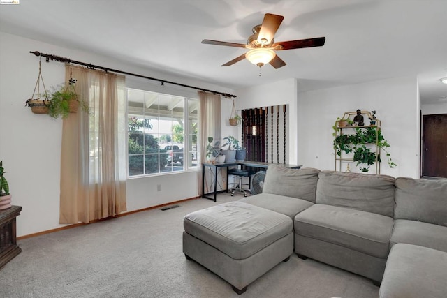 living room with carpet flooring and ceiling fan