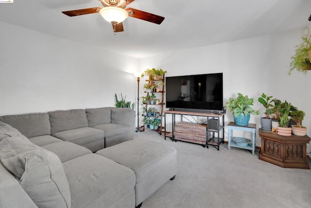 living room with light colored carpet and ceiling fan