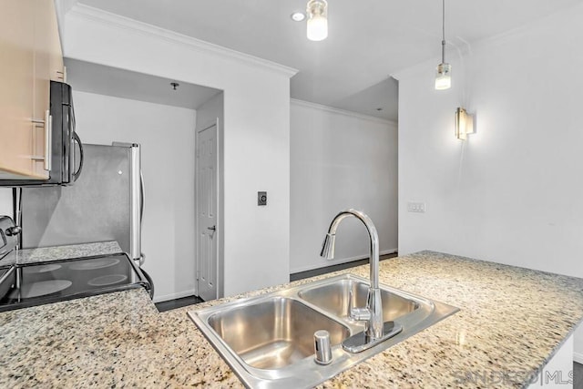 kitchen featuring sink, hanging light fixtures, ornamental molding, and kitchen peninsula