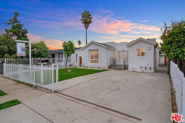 view of front of home with a yard