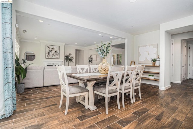 dining area featuring ornamental molding and dark wood-type flooring