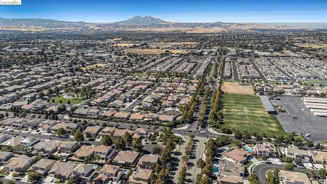 birds eye view of property with a mountain view