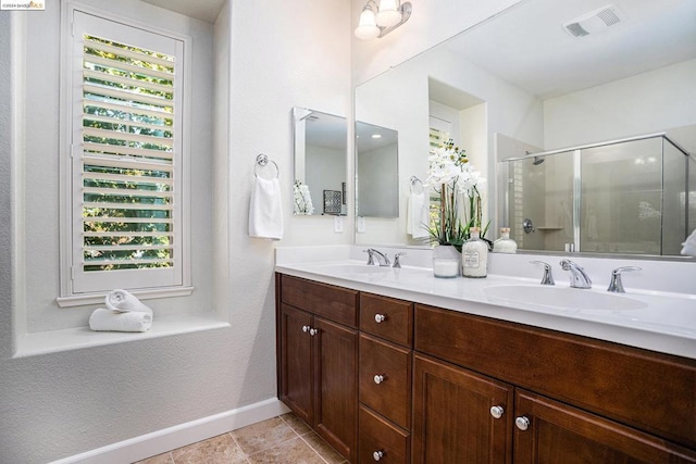 bathroom with vanity and walk in shower