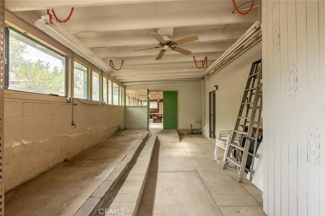 interior space with ceiling fan