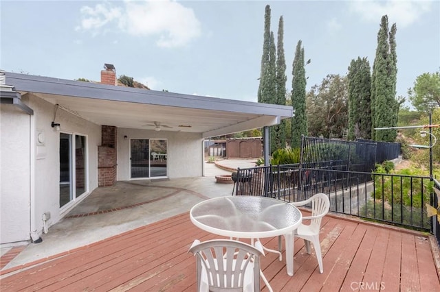 wooden deck featuring ceiling fan