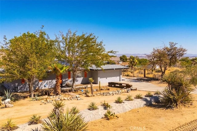 view of yard featuring a garage