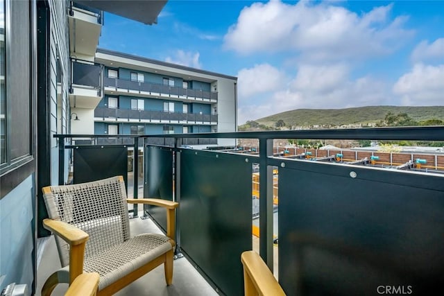 balcony featuring a mountain view