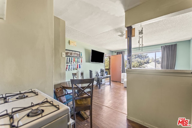 interior space featuring a textured ceiling and hardwood / wood-style flooring