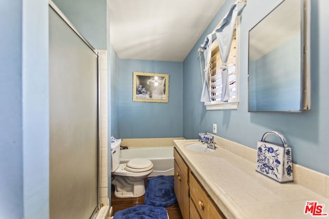 full bathroom featuring independent shower and bath, hardwood / wood-style flooring, vanity, and toilet