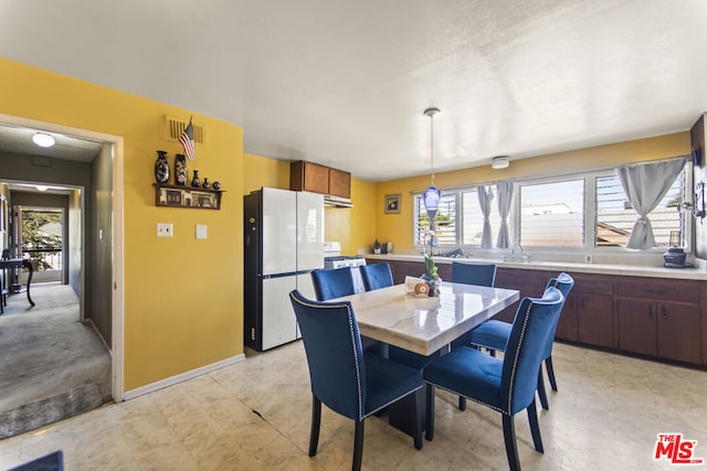 dining space with sink