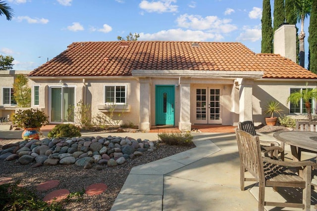 rear view of property featuring a patio area