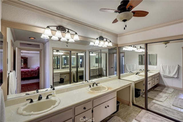 bathroom with vanity, ceiling fan, and ornamental molding