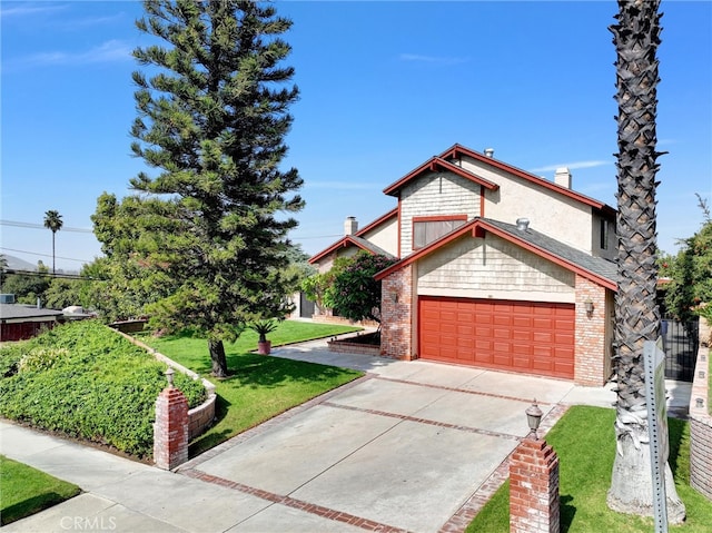 view of front of house with a garage and a front lawn