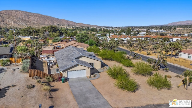 drone / aerial view featuring a mountain view