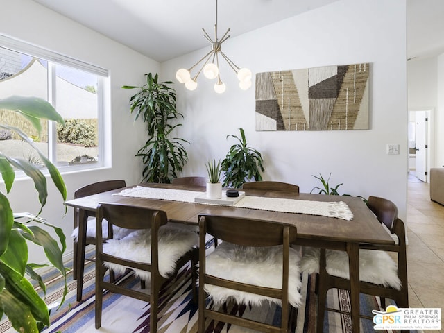 tiled dining space with a notable chandelier