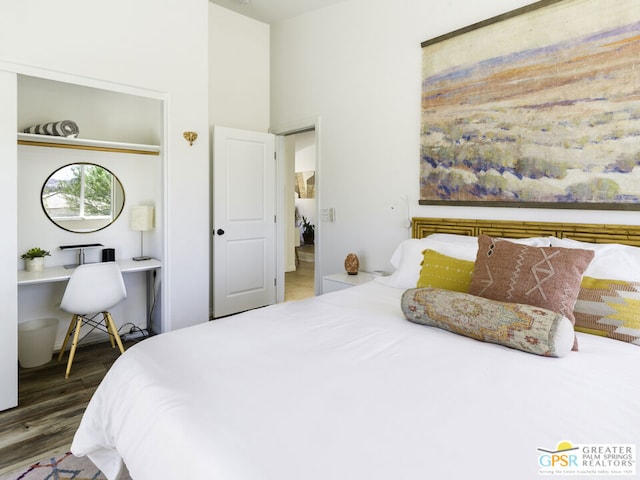 bedroom featuring dark hardwood / wood-style flooring