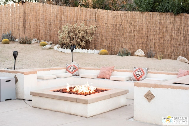 view of patio featuring a fire pit