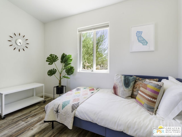 bedroom featuring dark hardwood / wood-style flooring